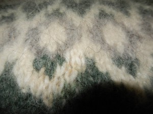 closeup of hand knit real lopi sweater - purchased in iceland - long hairy look is due to the long tog fibres in the yarn