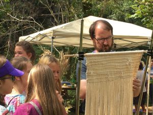 My husband Chris demonstrates a type of prehistoric weaving, twining, to school children. The boys always seem reluctant to try the weaving because ‘that’s what girls do’ but seeing a man take the lead on the actual weaving inspired them to give it a go.