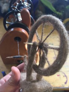 Using the HansenCrafts miniSpinner to wind some thread onto my felted spinning wheel