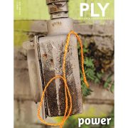 Power Cover - strand of yarn hanging over a rusted piece of metal