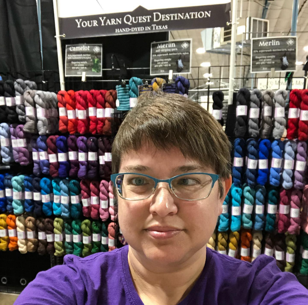 Karen in her booth for Round Table Yarns